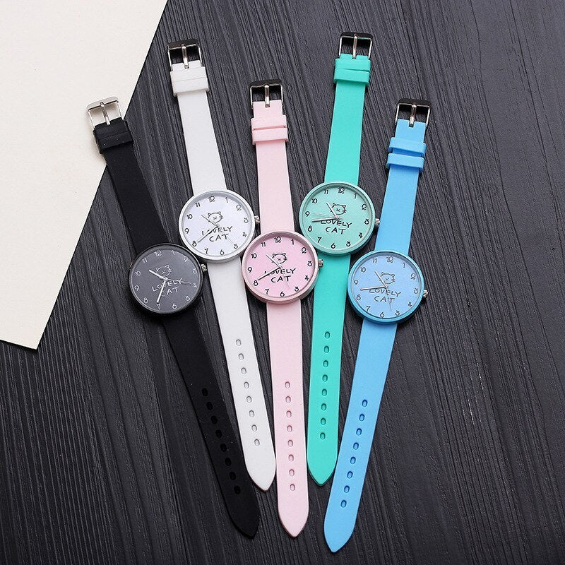 Add fun and style to your kid's wrist with this cute, colorful cat-themed silicone watch! color  Black, White, Light blue, light pink . face front or straigh