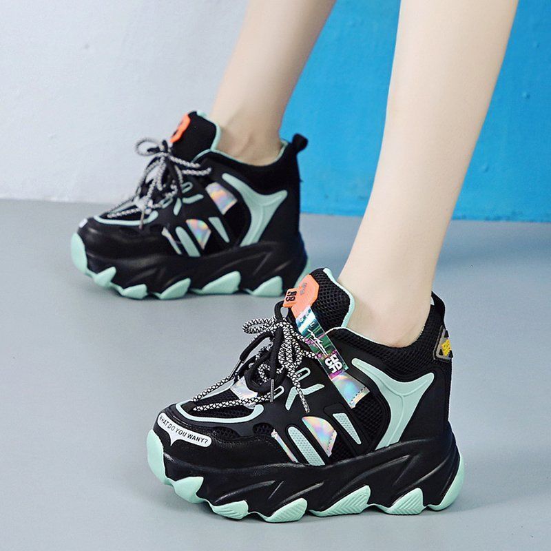 Step up your style game with breathable, height-boosting chunky sneakers—fashion meets comfort! color's are black and white . face  left 